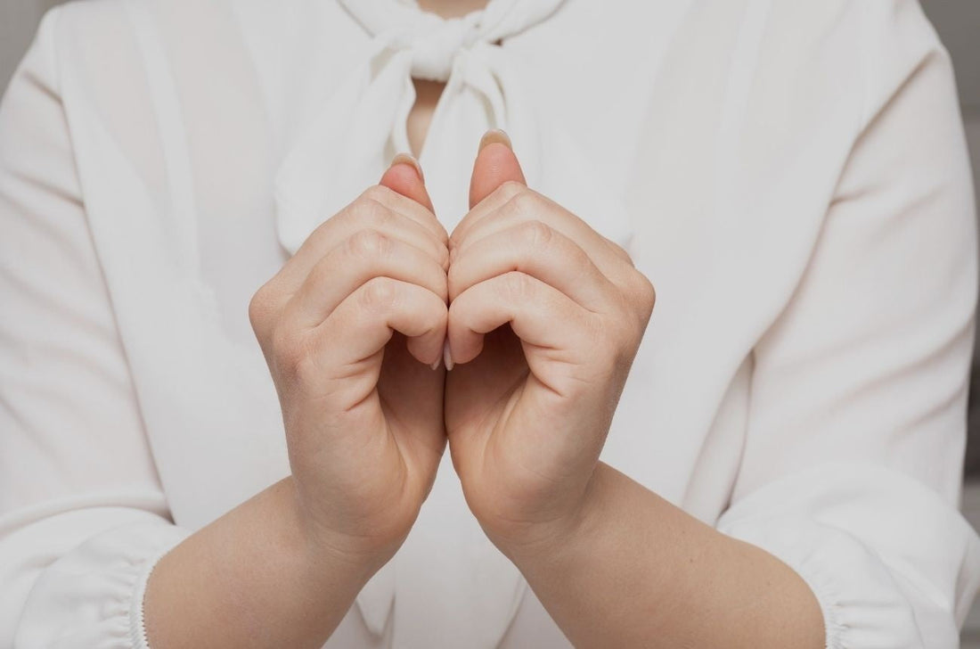 A person practicing the Balayam technique by rubbing fingernails together. natural hair exercises, reflexology hair methods, scalp stimulation tips